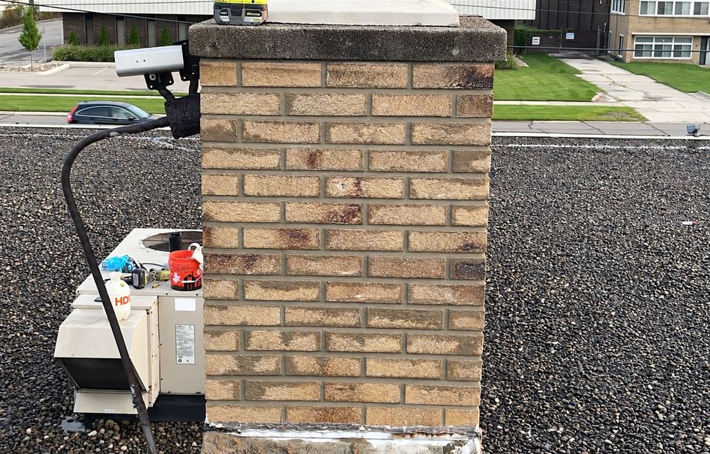 The same chimney after tuckpointing, with clean full mortar joints
