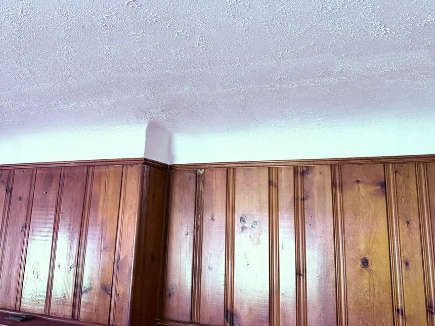 The same living room ceiling corner repaired and repainted